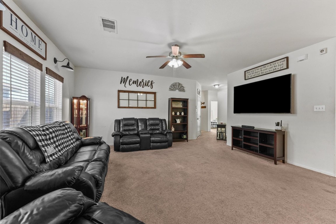 5303 Rivers Edge Drive Richmond, TX 77469 - Photo 4 of 26 a living room with furniture and a flat screen tv