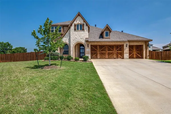 a front view of a house with yard