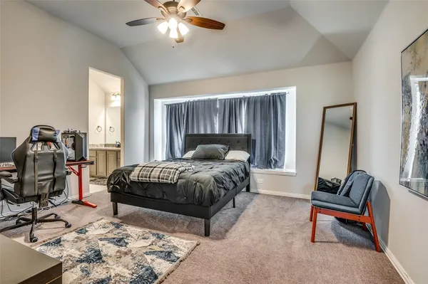a bedroom with a bed and a couch