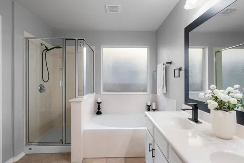 a backyard of a house with table and chairs