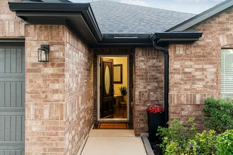 a view of a door of the house and a outdoor space