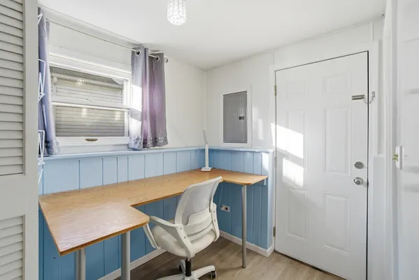 a room that has a table and chair in it
