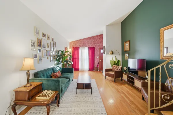 a living room with furniture and a potted plant
