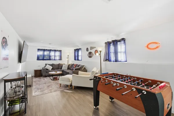 a bedroom with furniture and a wooden floor