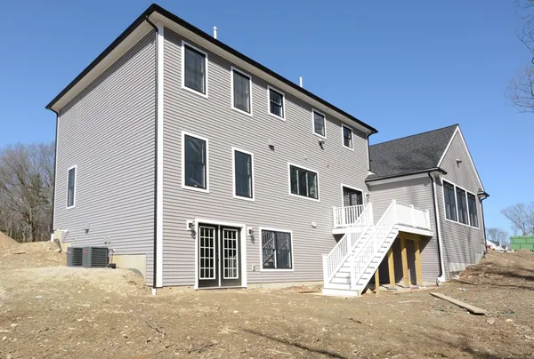 a view of a house with a street