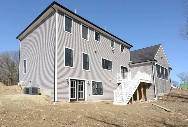 a view of a house with a street