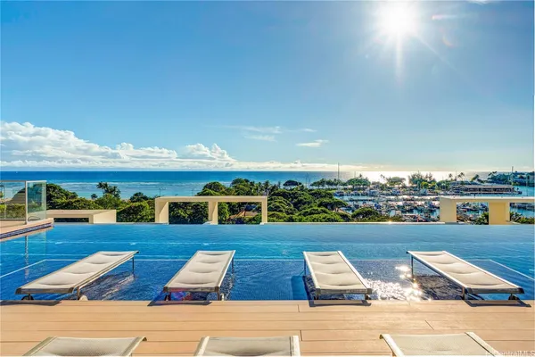a view of swimming pool with furniture