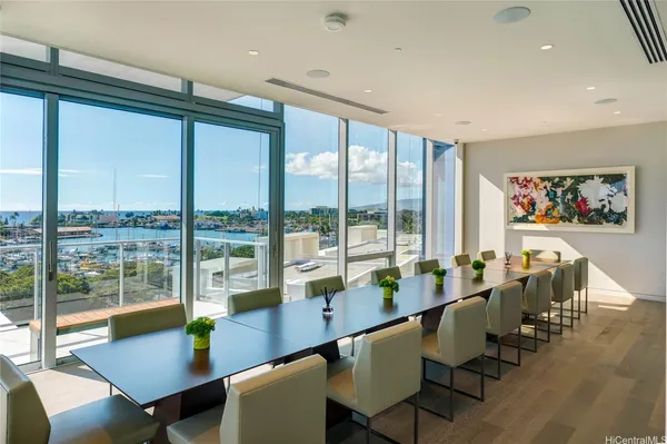 a room with furniture and large windows