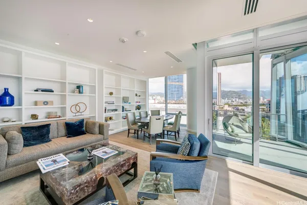 a living room with furniture and a large window