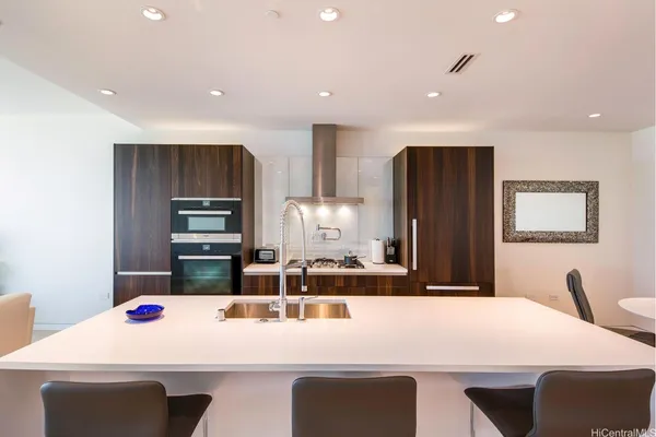 a kitchen with kitchen island and appliances