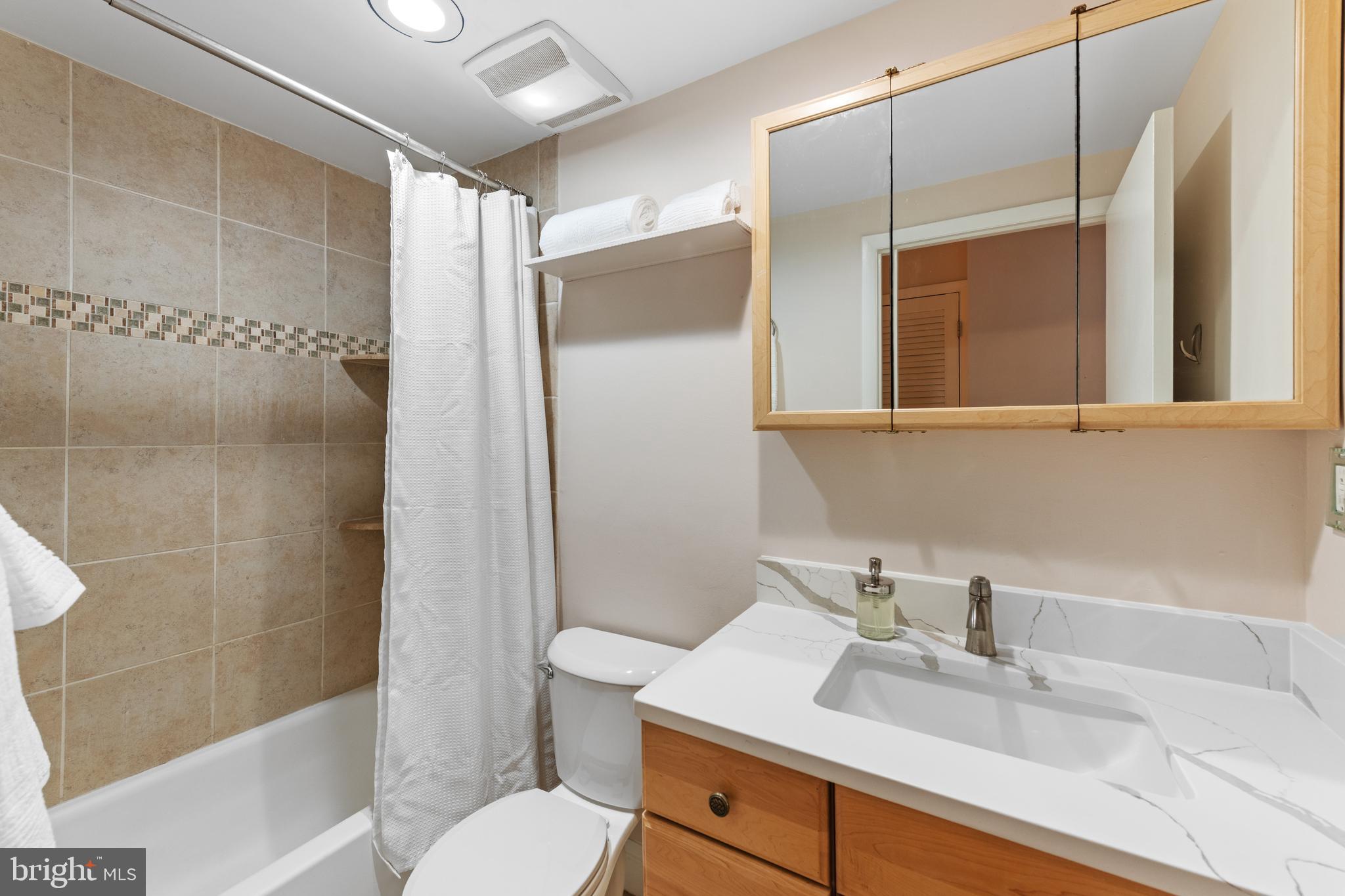 2012 O Street Northwest, Unit 22 Washington, DC 20036 - Photo 12 of 21 a bathroom with a sink toilet and shower