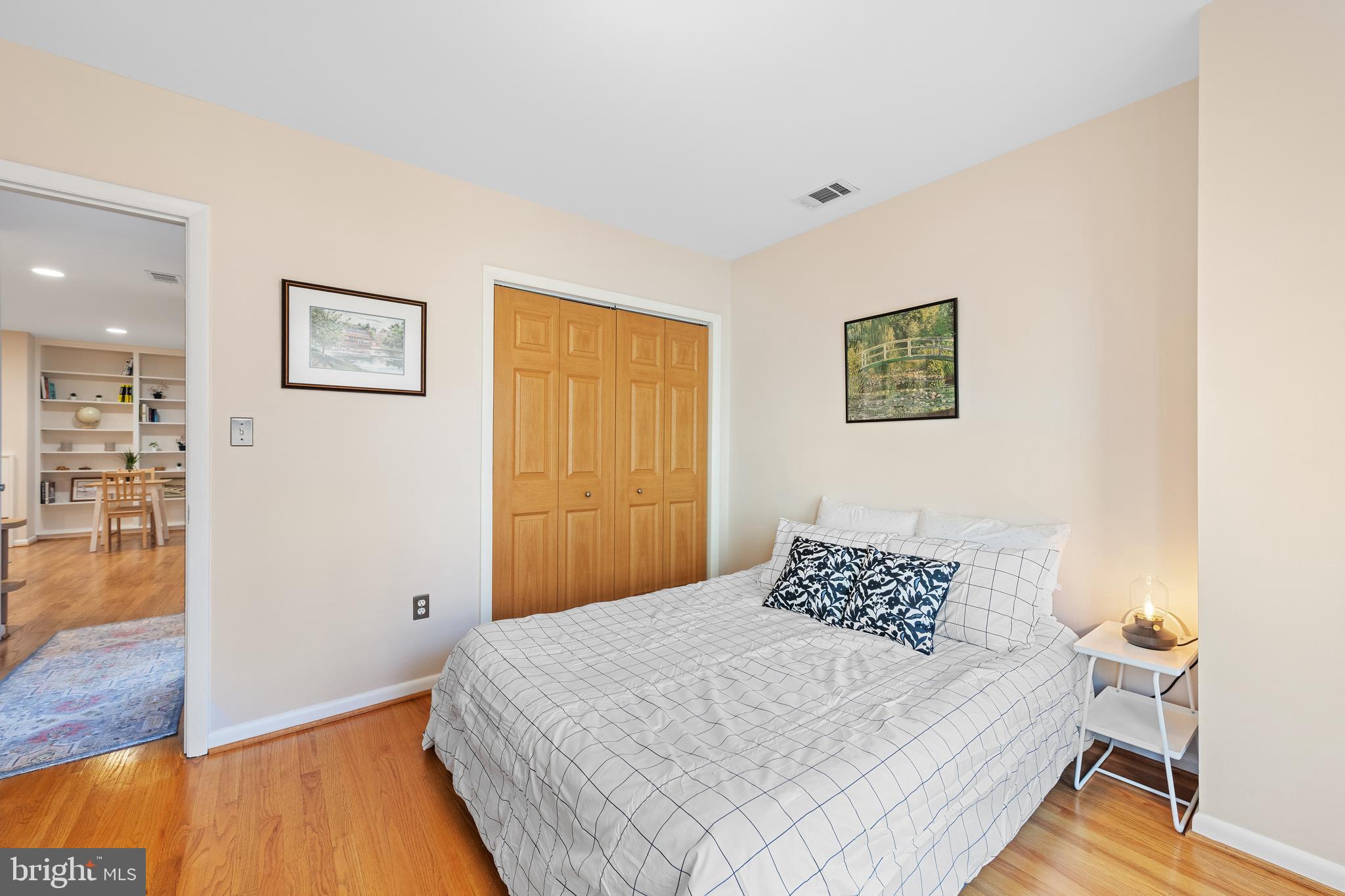 2012 O Street Northwest, Unit 22 Washington, DC 20036 - Photo 16 of 21 a bedroom with a bed and wooden floor