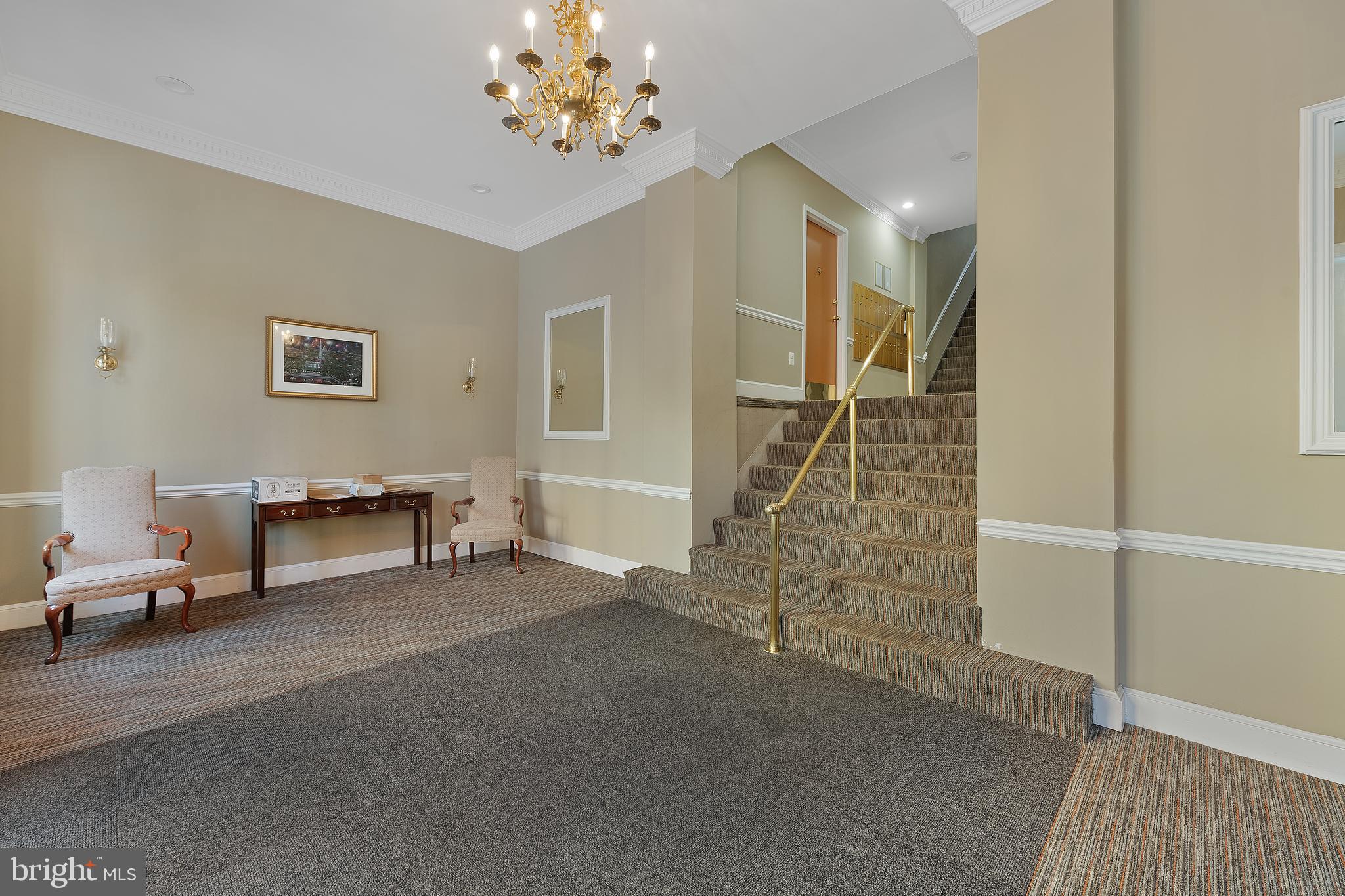 2012 O Street Northwest, Unit 22 Washington, DC 20036 - Photo 19 of 21 a living room with furniture and a chandelier