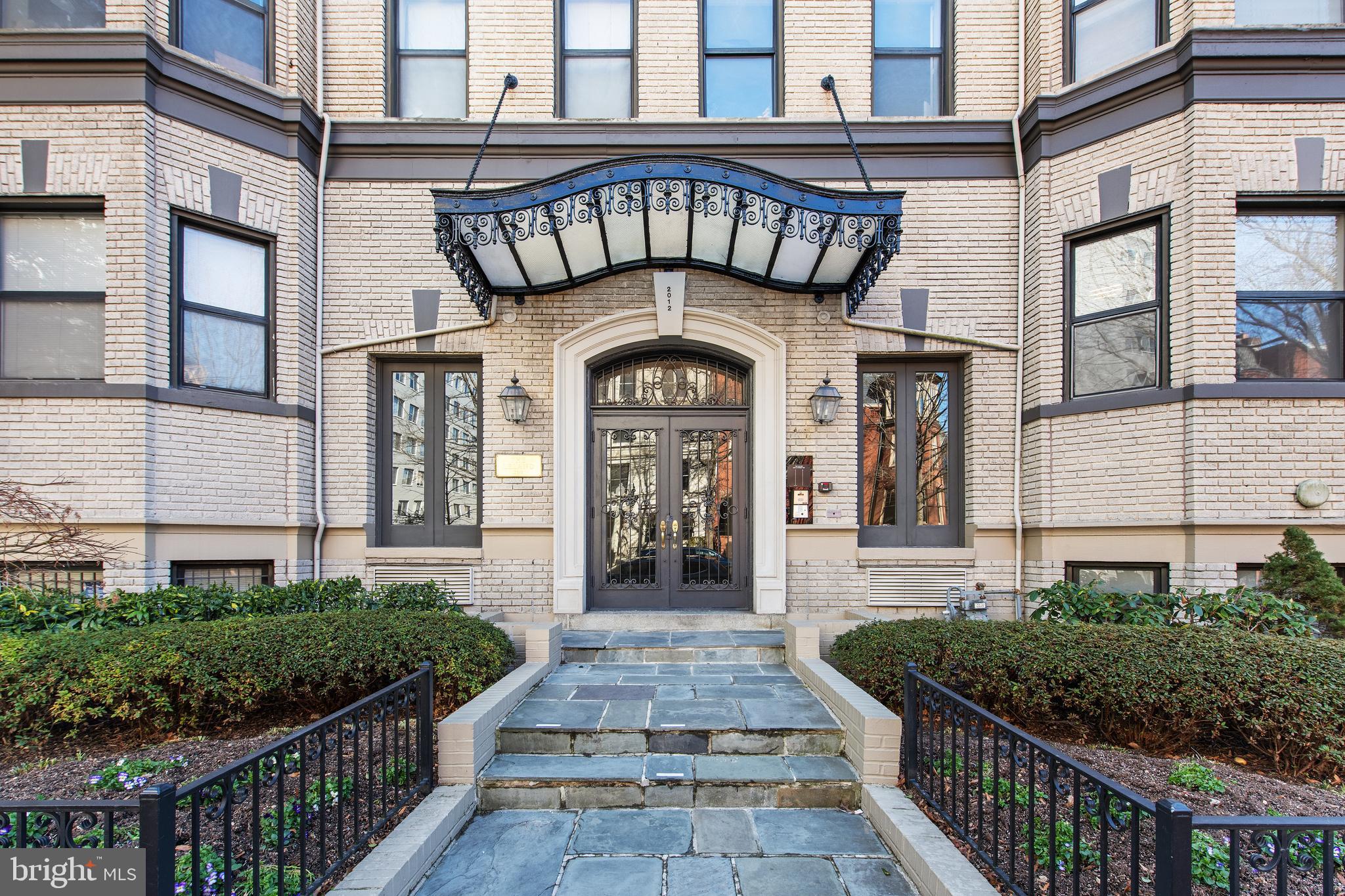 2012 O Street Northwest, Unit 22 Washington, DC 20036 - Photo 3 of 21 a front view of a house with a garden