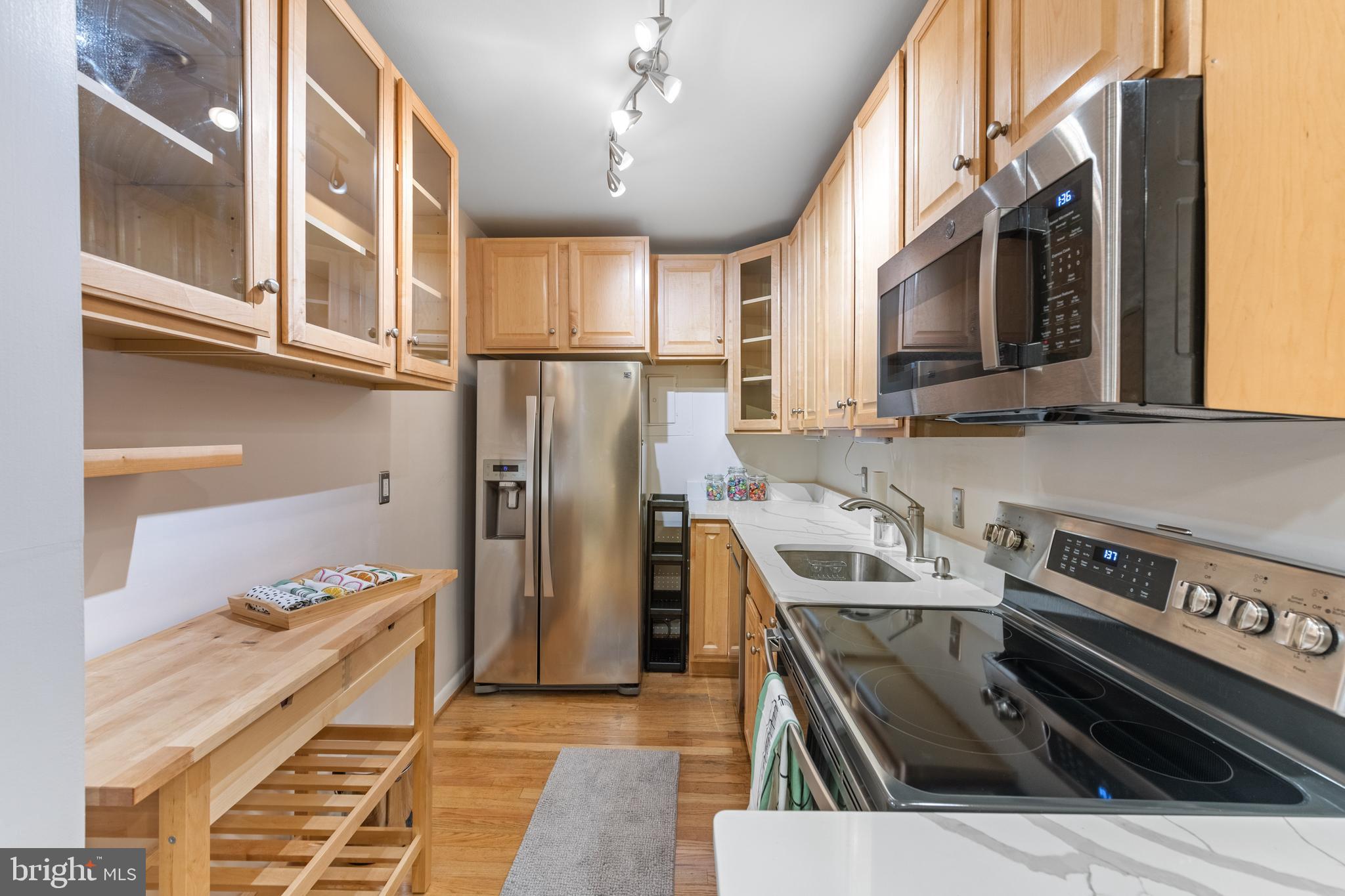 2012 O Street Northwest, Unit 22 Washington, DC 20036 - Photo 5 of 21 a kitchen that has a sink a stove and a microwave