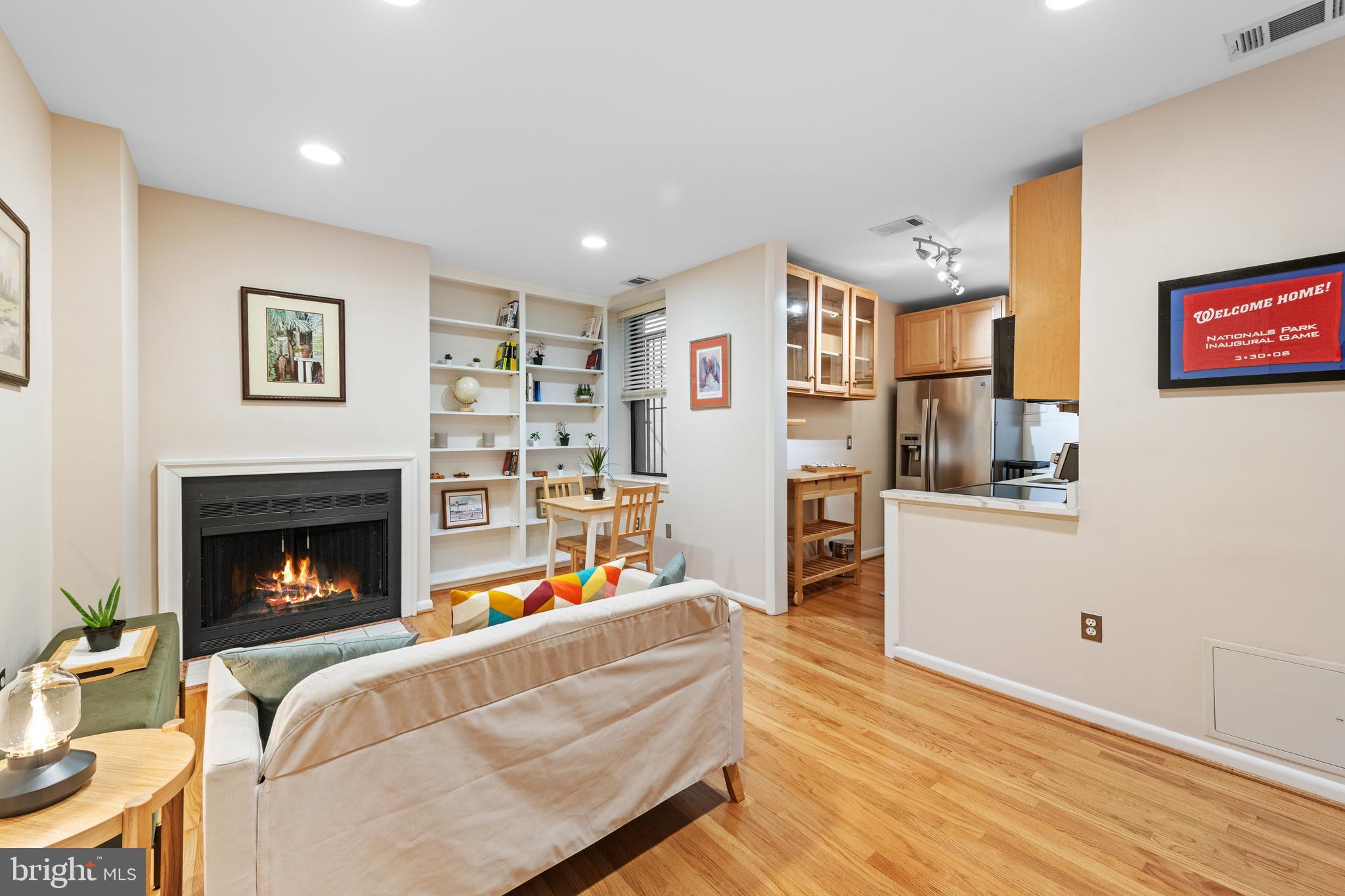 2012 O Street Northwest, Unit 22 Washington, DC 20036 - Photo 6 of 21 a living room with furniture and a fireplace