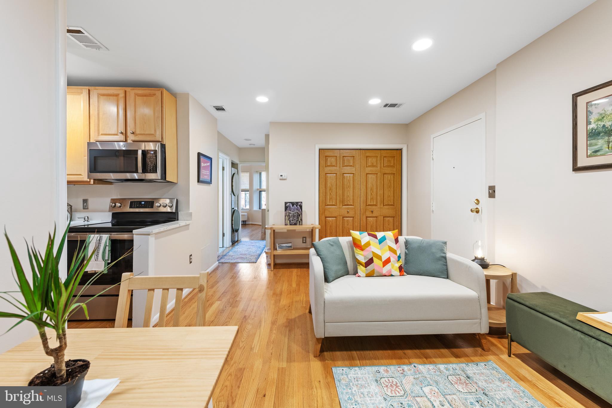 2012 O Street Northwest, Unit 22 Washington, DC 20036 - Photo 8 of 21 a spacious bedroom with a bed and wooden floor