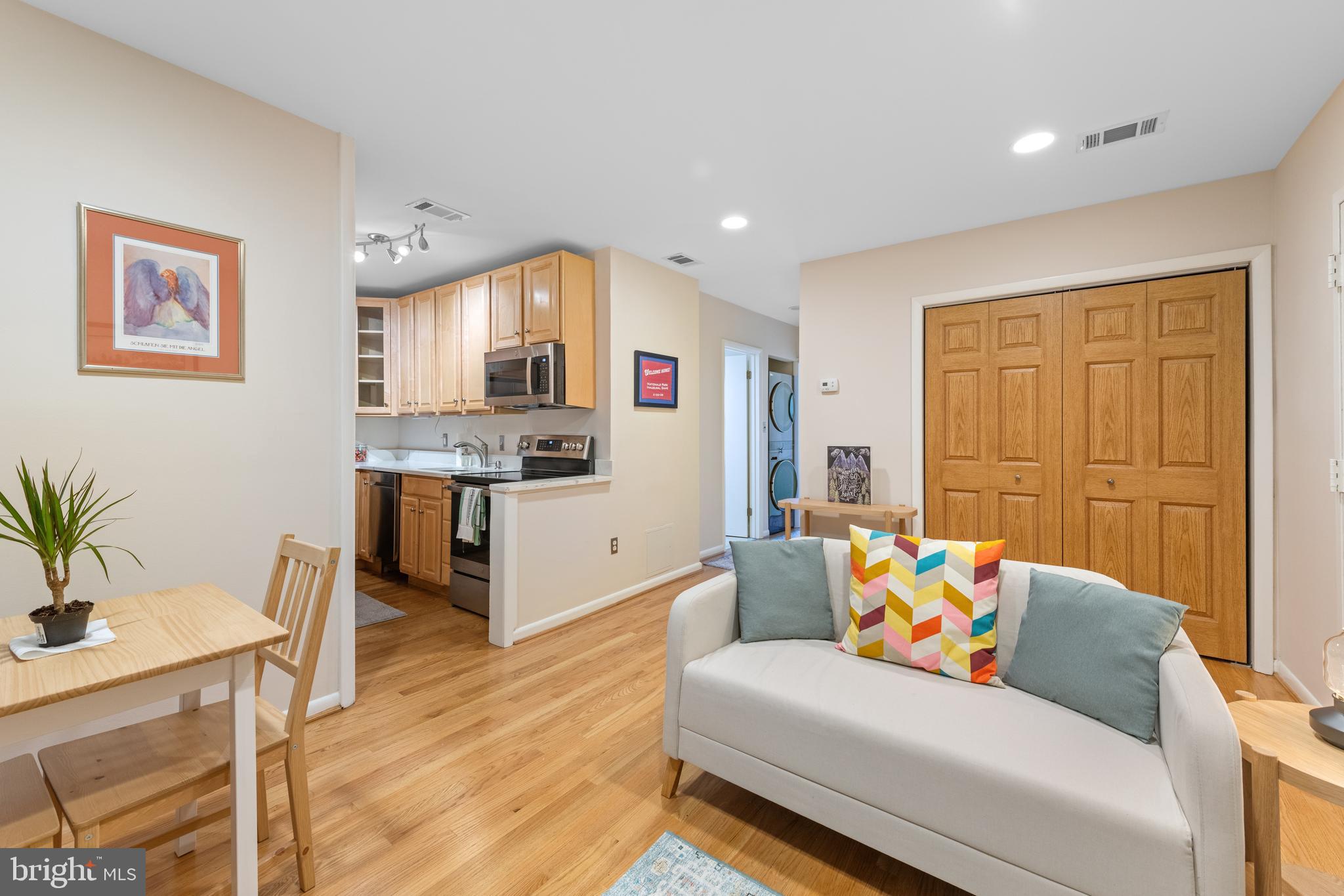 2012 O Street Northwest, Unit 22 Washington, DC 20036 - Photo 9 of 21 a living room with furniture and wooden floor