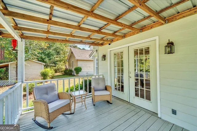 a room with wooden floor and furniture