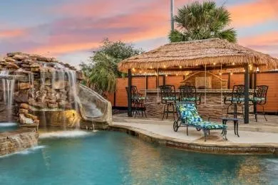 a small pool with table and chairs