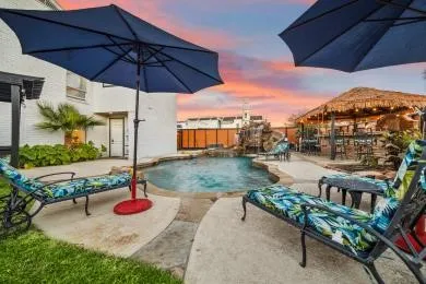 a view of a backyard with sitting area