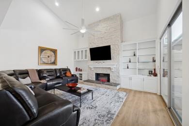 3029 Bering Drive Houston, TX 77057 - Photo 2 of 12 a living room with furniture a flat screen tv and a fireplace