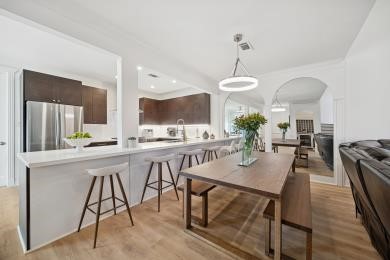 3029 Bering Drive Houston, TX 77057 - Photo 3 of 12 a dining room filled chandelier and kitchen view
