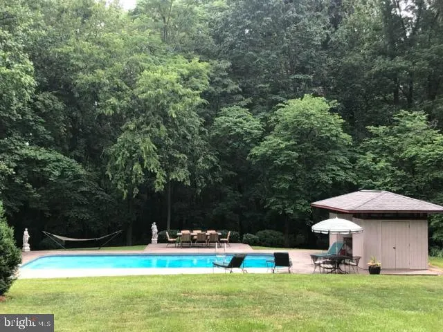 a view of a swimming pool with a patio