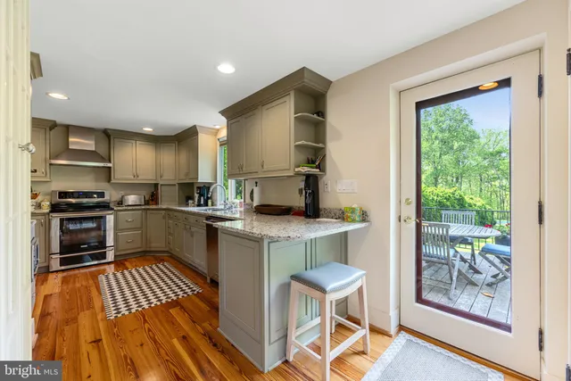 a kitchen with a sink appliances and cabinets