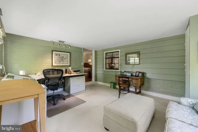 a workspace with furniture and a window