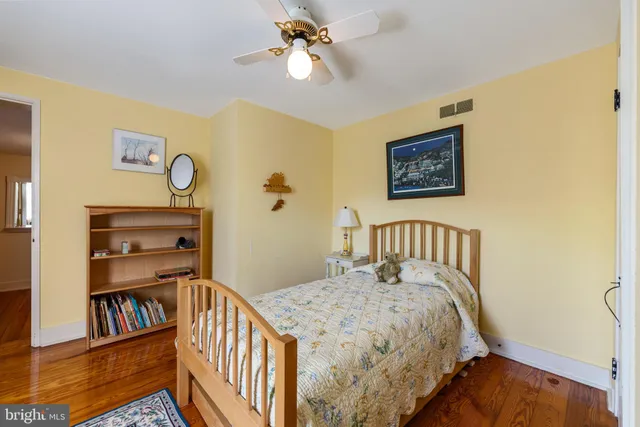 a bedroom with a bed and a fireplace