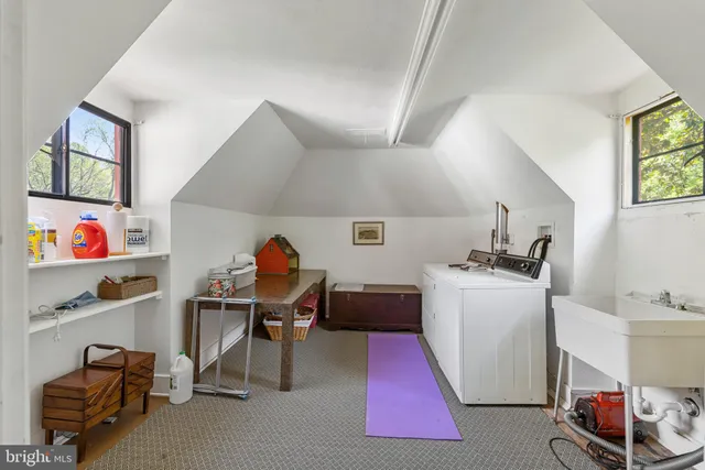 an aerial view of a houses with a yard