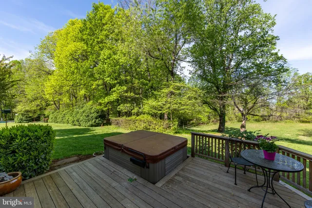 a view of a wooden deck with furniture