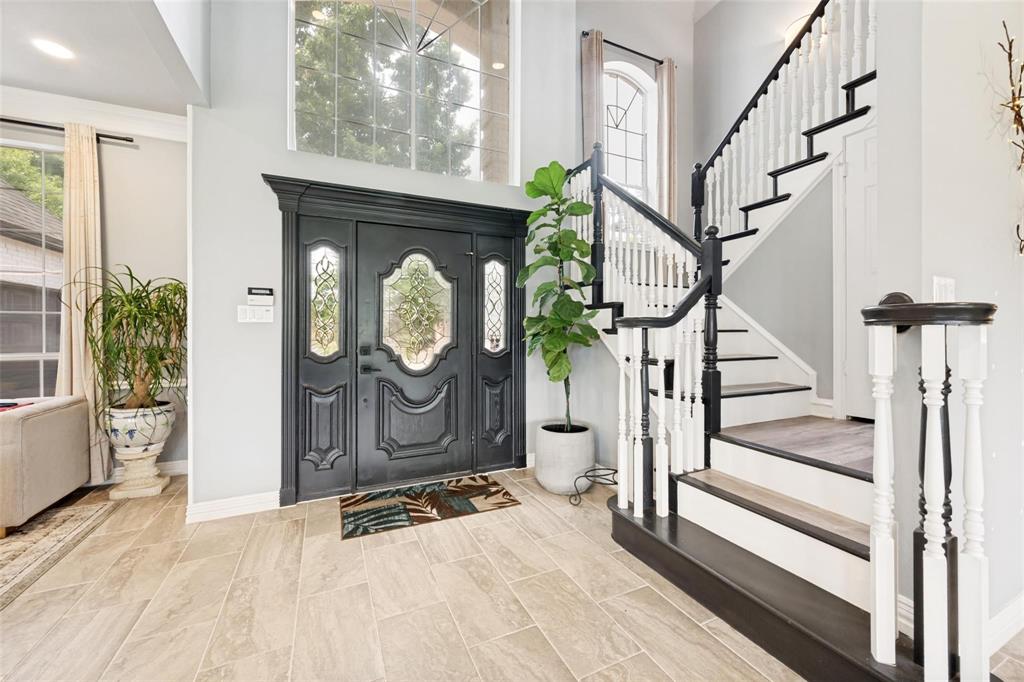 818 Riviera Drive Mansfield, TX 76063 - Photo 10 of 24 Grand entryway featuring a double door with decorative glass inserts, a transom window, and tile flooring