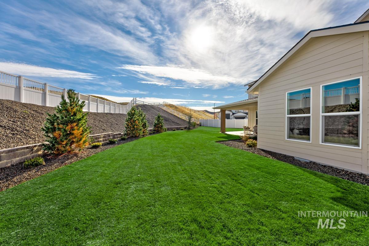13544 North Ruffed Grouse Place Boise, ID 83714 - Photo 26 of 42 Fenced backyard with a patio area