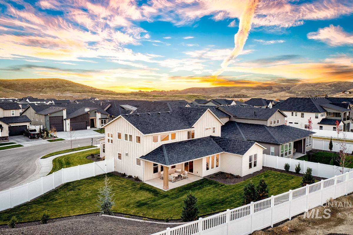 13544 North Ruffed Grouse Place Boise, ID 83714 - Photo 28 of 42 Aerial view of residential area featuring a mountainous background