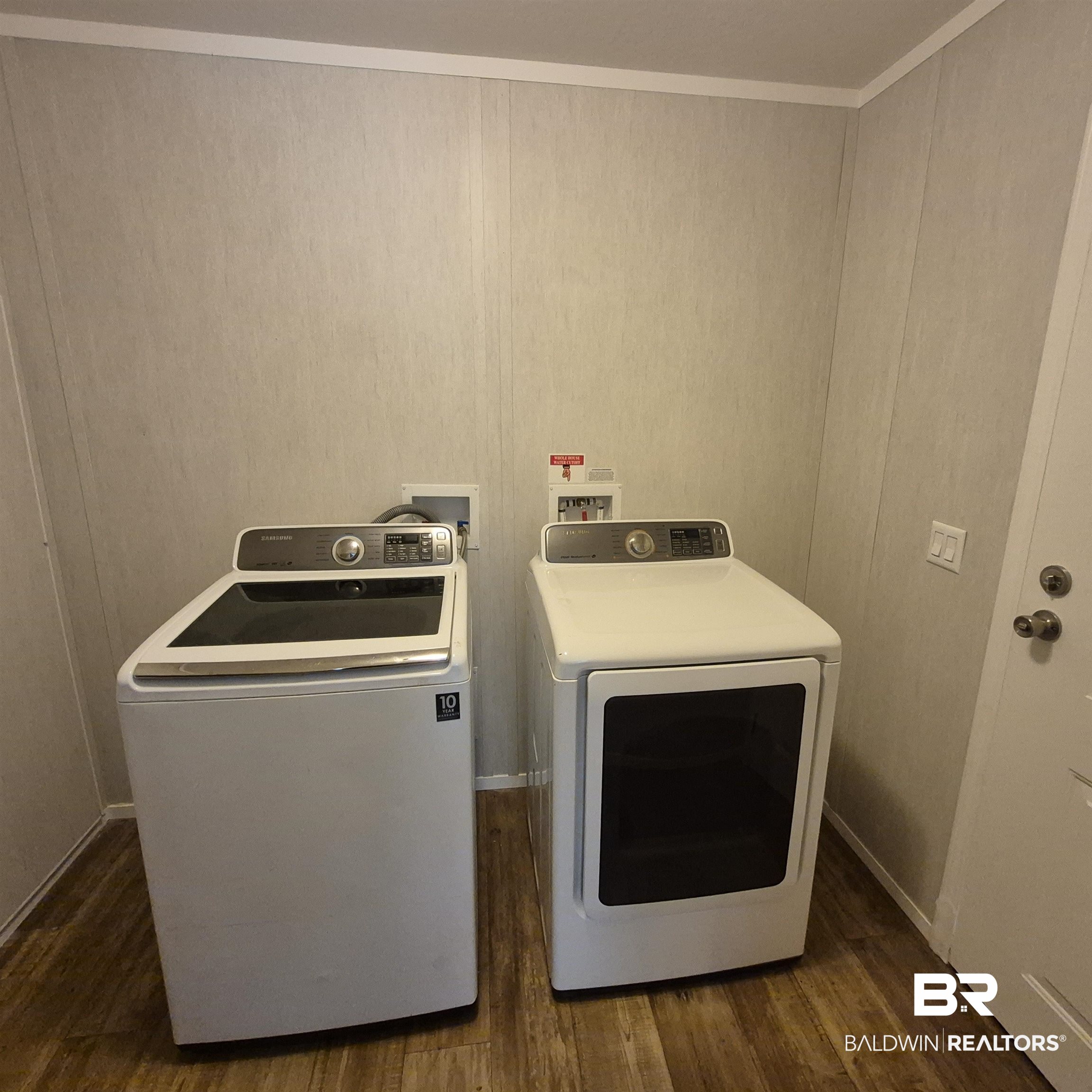 8867 Old Stage Road Repton, AL 36475 - Photo 27 of 37 Washroom with dark wood-style floors and independent washer and dryer