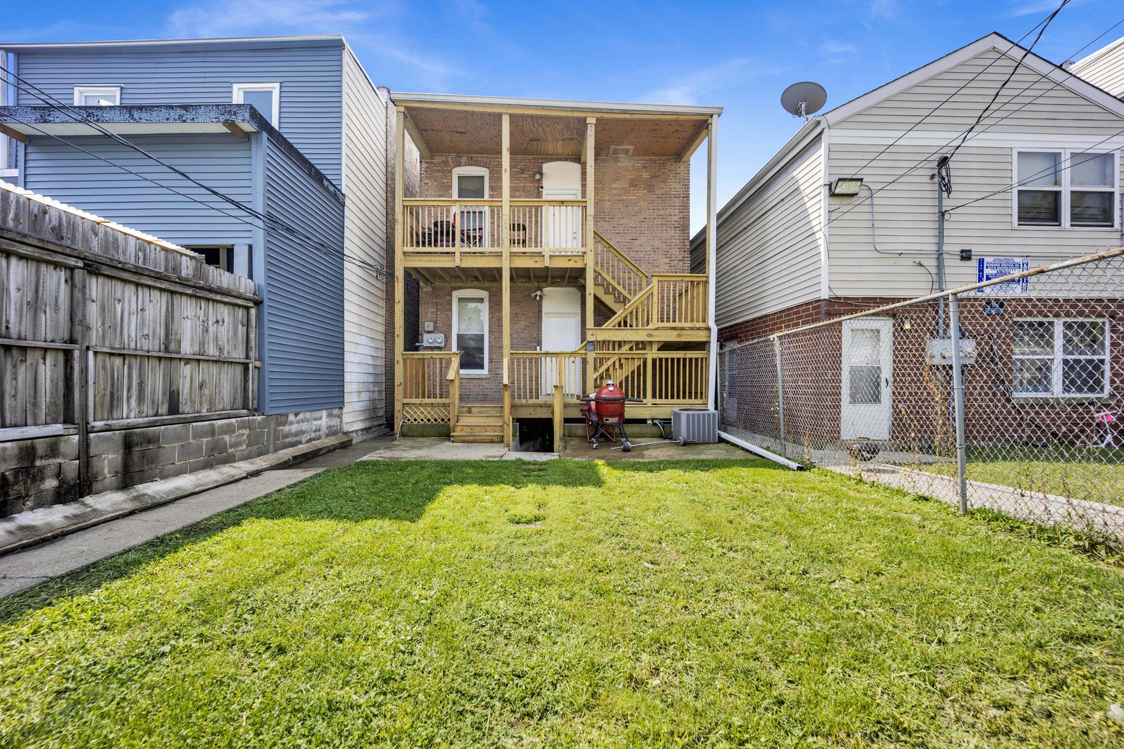 3326 West Crystal Street Chicago, IL 60651 - Photo 13 of 16 a view of a house with backyard and porch