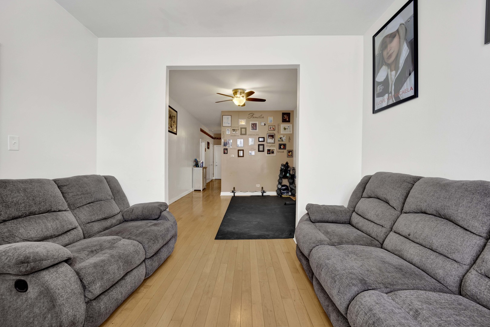 3326 West Crystal Street Chicago, IL 60651 - Photo 9 of 16 a living room with furniture and a chandelier