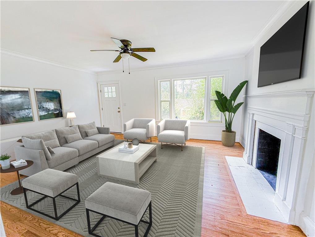 1679 Altadena Place Southwest Atlanta, GA 30311 - Photo 2 of 10 a living room with furniture fireplace and a flat screen tv
