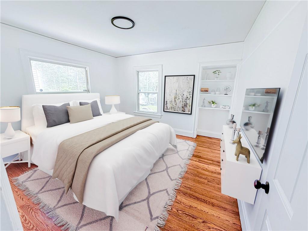 1679 Altadena Place Southwest Atlanta, GA 30311 - Photo 5 of 10 a spacious bedroom with a bed and a large mirror