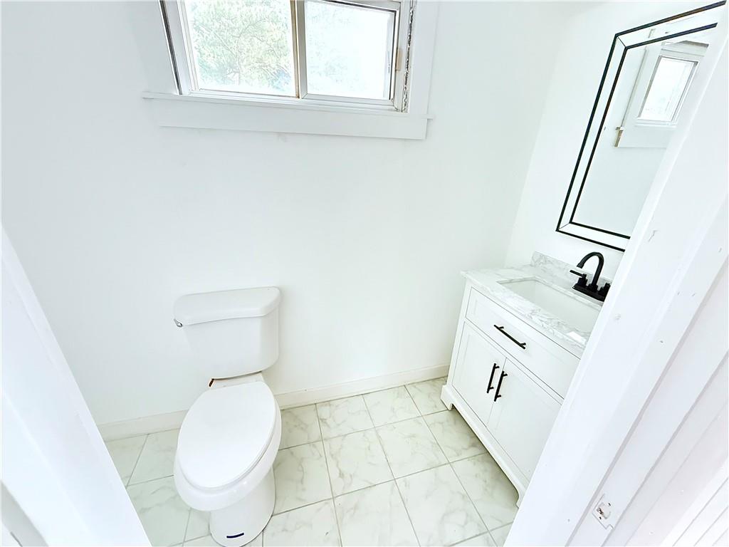 1679 Altadena Place Southwest Atlanta, GA 30311 - Photo 8 of 10 a bathroom with a sink and a toilet