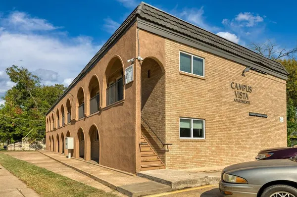 a view of a house with a street