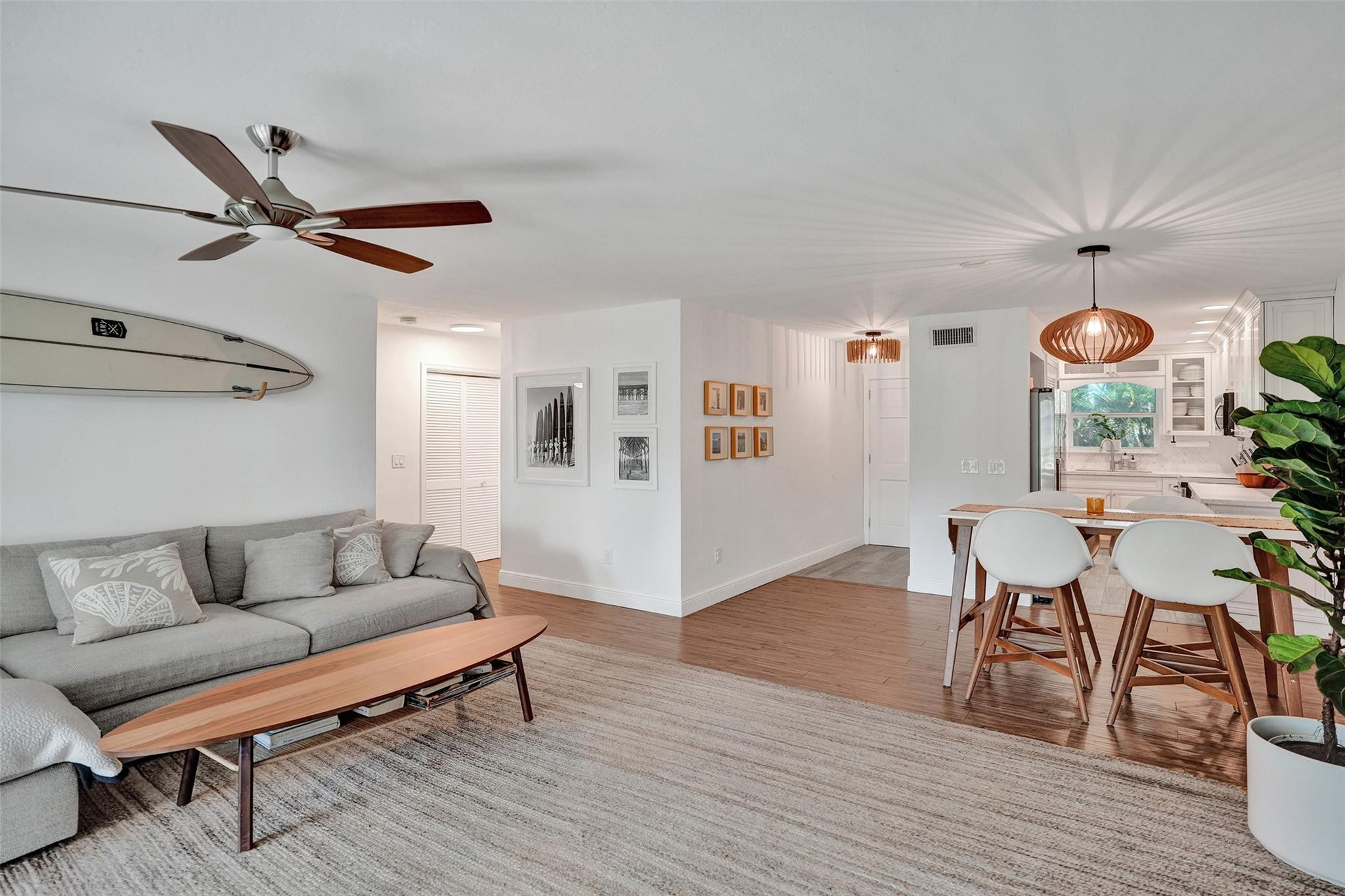 2501 South Ocean Boulevard, Unit 103 Boca Raton, FL 33432 - Photo 15 of 49 a living room with furniture and a wooden floor