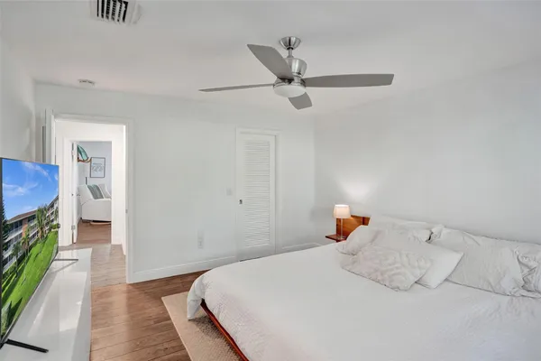 a bedroom with a bed and a view of bathroom