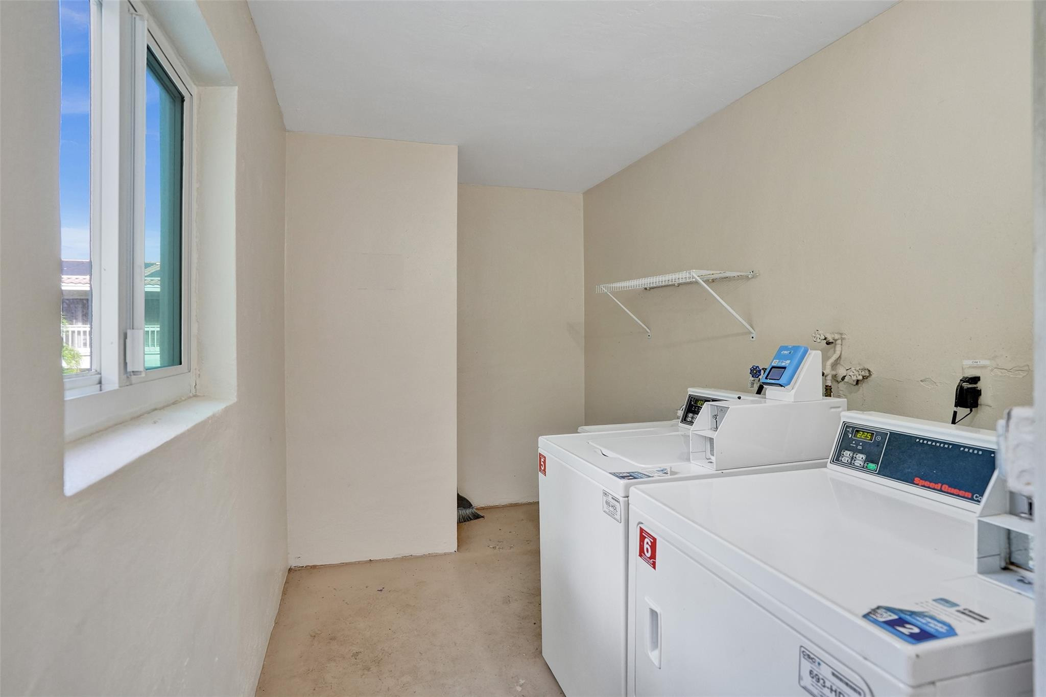 2501 South Ocean Boulevard, Unit 103 Boca Raton, FL 33432 - Photo 30 of 49 a utility room with dryer and washer