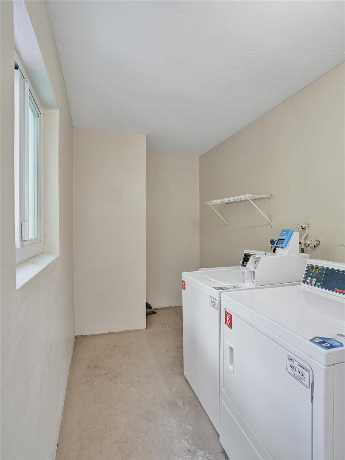 2501 South Ocean Boulevard, Unit 103 Boca Raton, FL 33432 - Photo 31 of 49 a utility room with dryer and washer