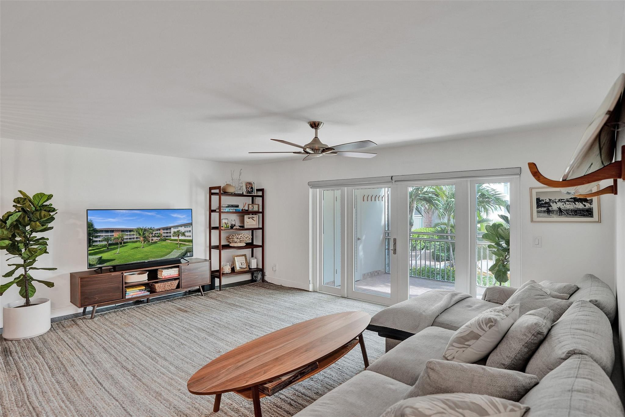 2501 South Ocean Boulevard, Unit 103 Boca Raton, FL 33432 - Photo 7 of 49 a living room with furniture and a flat screen tv