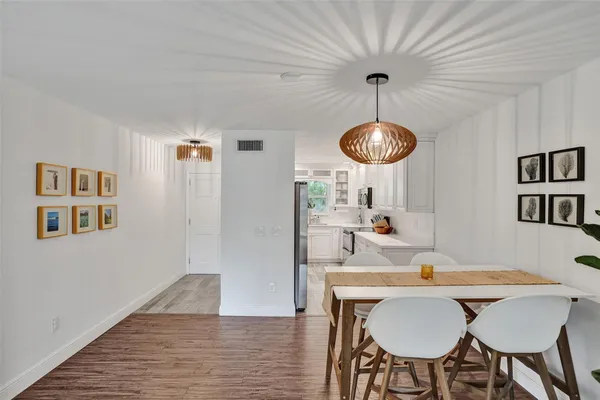a kitchen with stainless steel appliances granite countertop a sink and a stove