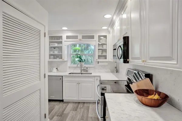 a kitchen with a sink and cabinets